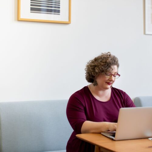 Woman working on the computer at her desk