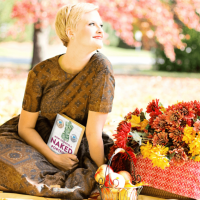 Woman enjoying fall reading a book