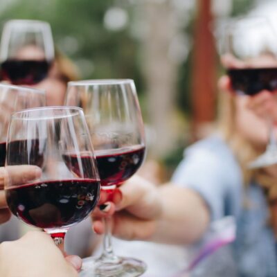 Women celebrating - cheers with wine