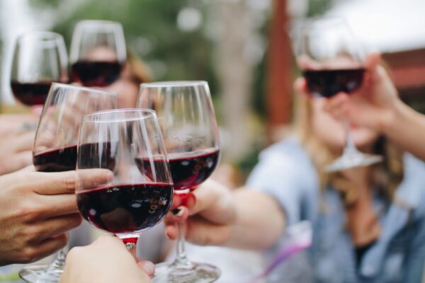 Women celebrating - cheers with wine